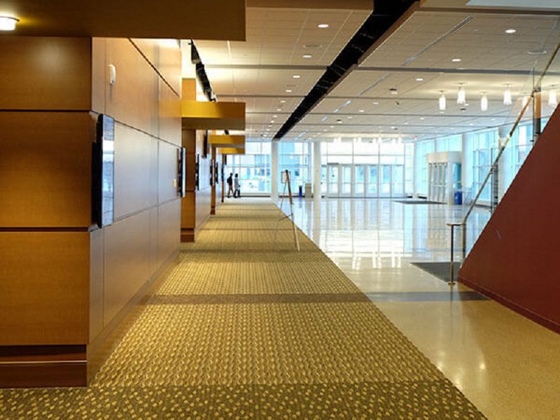 Spacious modern hallway with glass entrance doors.