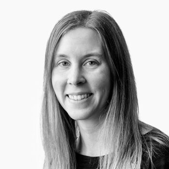 Smiling woman with long straight hair.