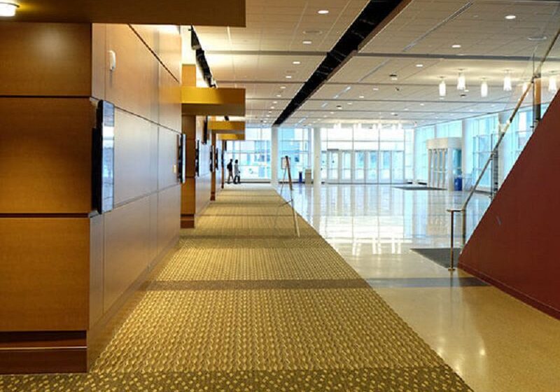 Spacious modern hallway with glass entrance doors.